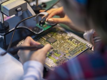 Close up woman hand car chip tuning